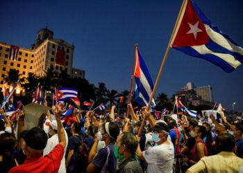Cubans participate in an act of revolutionary reaffirmation to support the government of President Miguel Diaz-Canel in Havana, on July 17, 2021. - Former Cuban President Raul Castro and his successor, Miguel Diaz-Canel, led an "act of revolutionary reaffirmation" in front of thousands of supporters in Havana on July 17, six days after the historic protests that shook the country. (Photo by YAMIL LAGE / AFP) (Photo by YAMIL LAGE/AFP via Getty Images)