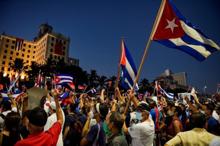 Cubans participate in an act of revolutionary reaffirmation to support the government of President Miguel Diaz-Canel in Havana, on July 17, 2021. - Former Cuban President Raul Castro and his successor, Miguel Diaz-Canel, led an "act of revolutionary reaffirmation" in front of thousands of supporters in Havana on July 17, six days after the historic protests that shook the country. (Photo by YAMIL LAGE / AFP) (Photo by YAMIL LAGE/AFP via Getty Images)