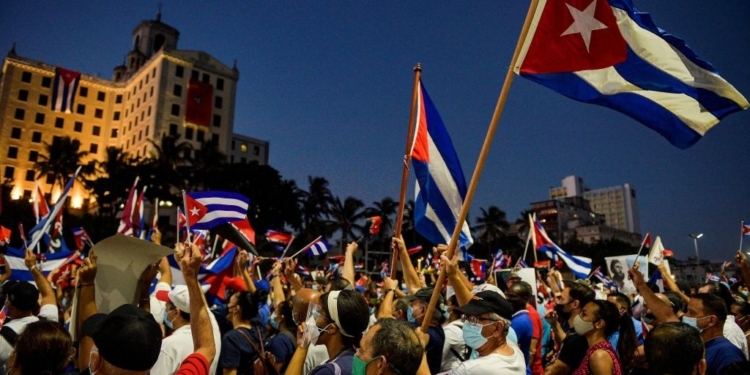 Cubans participate in an act of revolutionary reaffirmation to support the government of President Miguel Diaz-Canel in Havana, on July 17, 2021. - Former Cuban President Raul Castro and his successor, Miguel Diaz-Canel, led an "act of revolutionary reaffirmation" in front of thousands of supporters in Havana on July 17, six days after the historic protests that shook the country. (Photo by YAMIL LAGE / AFP) (Photo by YAMIL LAGE/AFP via Getty Images)